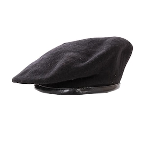 May include: A black beret with a black leather band around the bottom.