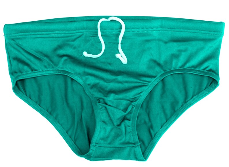 May include: Teal-colored underwear with a white drawstring. The briefs have a classic cut with a comfortable waistband and a soft, smooth texture. The garment is made of a lightweight material.