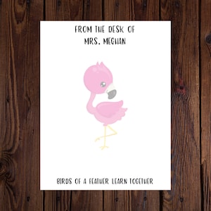 May include: An illustration of a pink flamingo with the text "From the desk of Mrs. Meghan" and "Birds of a feather learn together" on a white background.