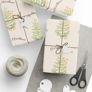 Cream wrapping paper with classic pooh holding a fresh cut tree with snow on it, with a brown Merry Christmas on it