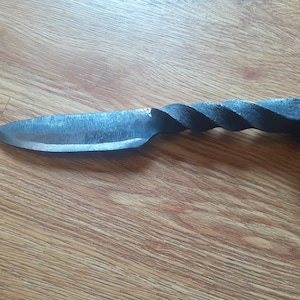 Hand forged railroad spike strait bladed camp knife with twisted handle