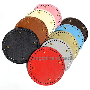 May include: Assortment of round, leather base circles in various colors, including black, brown, red, beige, gray, light blue, and pink. Each circle has a row of small holes around the edge and brass rivets in the center.