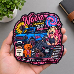 May include: A decorative patch featuring a blue Bronco vehicle, a sunflower, two dogs, and a person reading a book titled Fae Smut. Text includes Nova, She is Sunshine Mixed with a Little Hurricane, and A Lotta Class with a Little Sass, plus a list of interests.