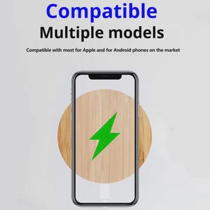 May include: A smartphone with a wooden charging pad displaying a green lightning bolt. The text at the top reads "Compatible Multiple models". The image suggests wireless charging compatibility for Apple and Android phones.