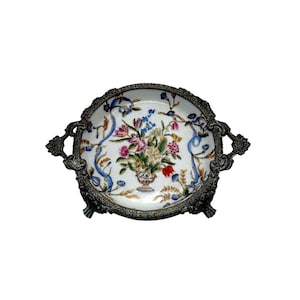 May include: A white ceramic mug with a black handle and the text "But First, Coffee" in a black, bold font. The mug is on a wooden surface. The mug is 10 cm tall.