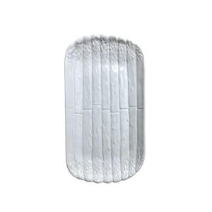 May include: A white rectangular serving platter with a textured asparagus design. The platter is made of ceramic and has a slightly curved shape. The asparagus stalks are vertically arranged across the surface.