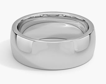 May include: A polished, silver-colored ring with a rounded, domed design. The ring has a smooth, reflective surface, and the band is approximately 0.25 inches wide. The ring is a classic style, suitable for various occasions.