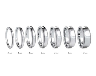 May include: A set of eight platinum wedding bands in different widths, ranging from 2 mm to 8 mm. The bands are all smooth and polished, with a slightly rounded edge.