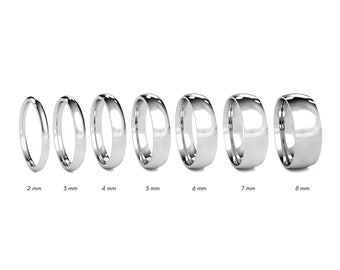May include: A set of eight platinum wedding bands in different widths, ranging from 2 mm to 8 mm. The bands are all polished and have a smooth, rounded profile.