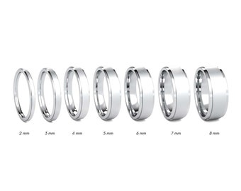 May include: A set of seven platinum wedding bands in different widths, ranging from 2 mm to 8 mm. The bands are all smooth and polished.