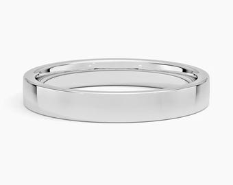 May include: A polished, silver-colored ring with a flat band. The ring has a smooth, reflective surface, and the design is simple and elegant. The ring is likely made of a precious metal, such as platinum or white gold.