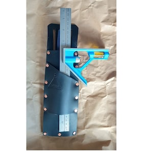 May include: A black leather tool holder with copper rivets and a blue and yellow combination square and level.