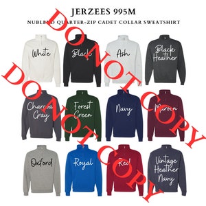 May include: A selection of 10 Jerzees 995M NUBLEND Quarter-Zip Cadet Collar Sweatshirts in various colors, including white, black, ash, black heather, charcoal gray, forest green, navy, maroon, oxford, royal, red, and vintage heather navy.
