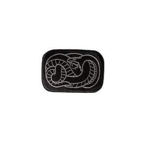 May include: Black embroidered patch featuring a silver snake design in the shape of an infinity symbol.