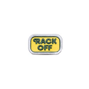 May include: A yellow and green embroidered patch with the text "BACK OFF" in a white border.