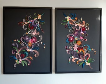 May include: Two framed pieces of paper art with colorful paper curls and flowers in a black frame.