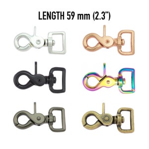 Könnte beinhalten: Sechs verschiedene Metall-Drehverschlüsse, jeder mit einer rechteckigen Schlaufe und einem D-Ring. Die Verschlüsse sind silber, roségold, schwarz, regenbogenfarben, antik messing und gunmetal. LÄNGE 59 mm (2,3")