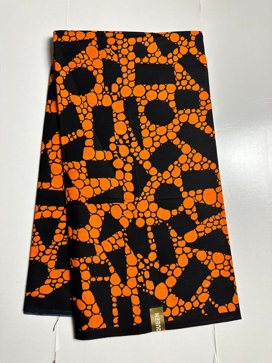 Fiery Orange Ankara Fabric with Bold Floral Accents