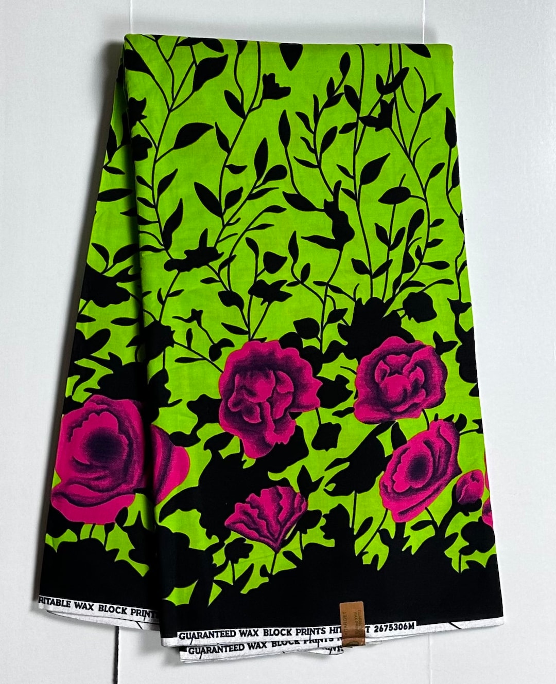 Vibrant Green and Pink Ankara Fabric with Nature-Inspired Patterns