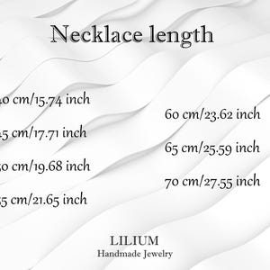 May include: A white graphic chart titled Necklace length listing measurements in centimeters and inches: 40 cm/15.74 inch, 45 cm/17.71 inch, 50 cm/19.68 inch, 55 cm/21.65 inch, 60 cm/23.62 inch, 65 cm/25.59 inch, 70 cm/27.55 inch, with LILIUM Handmade Jewelry text.