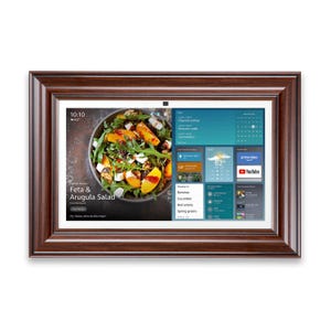 May include: A rectangular digital photo frame with a dark brown wooden frame. The screen displays a salad recipe, weather information, and app icons. The recipe is for Feta & Arugula Salad. The time is 10:10 and the temperature is 62 degrees.