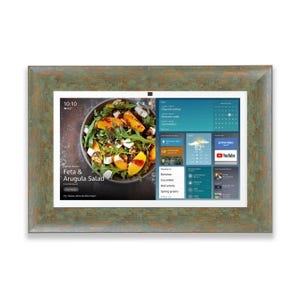 May include: A digital photo frame with a green and brown distressed wood-effect frame. The screen displays a salad recipe and weather information. The time is 10:10 and the temperature is 16.6 degrees Celsius. The screen also shows a calendar and app icons.