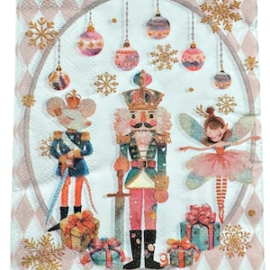 May include: A decorative Christmas napkin featuring a festive design. The napkin showcases a central illustration of a nutcracker, a mouse soldier, and a ballerina, surrounded by hanging ornaments and golden snowflakes. The background has a pink and white diamond pattern.