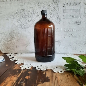 Antique brown glass bottle with stopper from the 1970s. Vintage brown apothecary bottle. Vase for dried flowers. Rustic house decor.