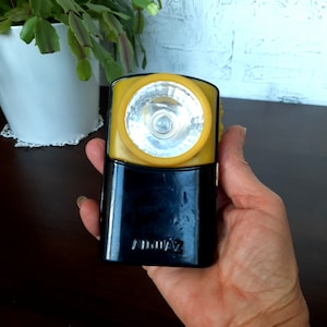 Vintage flashlight one light. Camping flashlight. Signal flashlight for hunting and fishing. Lantern night light.