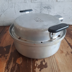 Old small aluminum stove, electric oven. Small electric frying pan with lid. Vintage electric aluminum roasting pan.  A gift for a farm