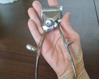 Old beard clipper, manual beard trimmer. Retro hand clipper. Barbershop decor