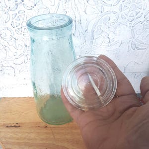 Vintage tall glass jar with glass lid. Antique storage jar. Retro kitchen. European spice jar. Vintage jar bottle. Shelf decoration.
