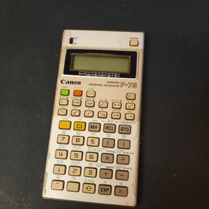Japanese calculator from the 1980s. Vintage Canon F-73 Scientific Calculator. Vintage Canon F-73 Scientific Calculator.
