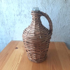 Vintage Small demijohn with Wicker Wrap, Rustic 1960s Glass Wine Bottle with Handle, 1 Liter demijohn with Handwoven Wicker Lid.
