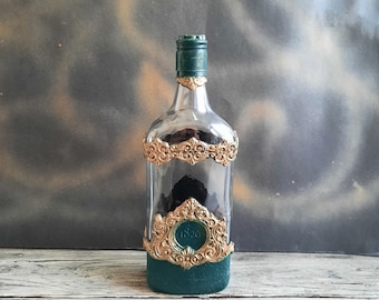 Decorated glass bottle. Hand decorated bottle in green with ornaments in gold. Decorated wine bottle. Art bottle gift. Art home decor