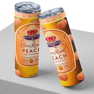 May include: Two stainless steel tumblers with a peach-themed design featuring the Crown Royal Peach logo and peaches. The tumblers are on a white surface.