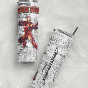 May include: Two stainless steel tumblers with comic book-style graphics. One features "Iron Man" in red and gold, the other displays "Stark Industries" and comic panels. Both have silver straws and lids.