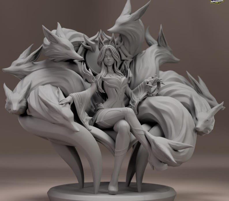 May include: A grey sculpture of a woman seated on a throne, surrounded by nine fox tails. The woman wears a crown and a detailed gown. The throne is adorned with intricate details, and the fox tails are arranged around the figure.