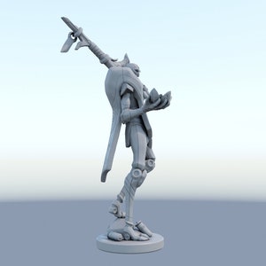 May include: A gray, futuristic figurine of a humanoid figure with an elongated arm holding a weapon. The figure is standing on a circular base and holding a crystal-like object in its other hand. The design has a mechanical aesthetic.