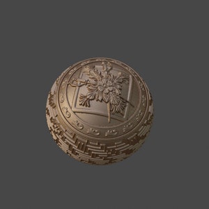 May include: A gold-colored sphere with a decorative design featuring a stylized flower and geometric patterns.
