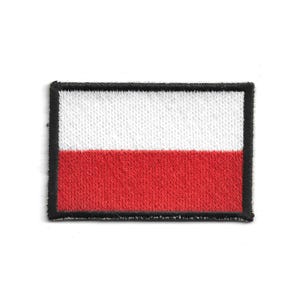 May include: Embroidered patch featuring the flag of Poland. The rectangular patch has a white upper half and a red lower half, with a black border. The design is simple and bold, suitable for various applications.