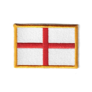 May include: Embroidered patch depicting the flag of England. The patch features a white background with a red cross, enclosed by a gold border. The patch is rectangular in shape.