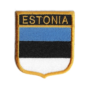 Könnte beinhalten: Ein gestickter Aufnäher mit der estnischen Flagge. Die Flagge ist blau, schwarz und weiß. Der Aufnäher ist goldfarben und trägt den Schriftzug "ESTONIA".