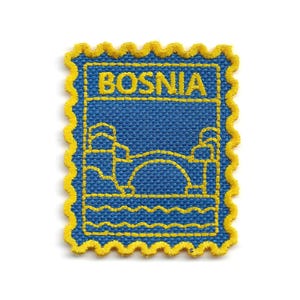 May include: A rectangular embroidered patch with a scalloped yellow border on a blue background. The design features the word BOSNIA in yellow thread above a stylized yellow outline of a bridge over water, resembling a postage stamp design.