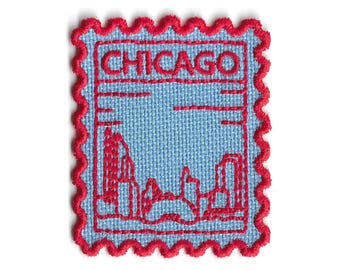 May include: Embroidered patch in the shape of a postage stamp featuring the city name "CHICAGO" in red letters. The patch has a light blue background with a red skyline design and a red scalloped border.