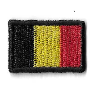 May include: A small embroidered patch featuring the Belgian flag. The flag is black, yellow, and red.
