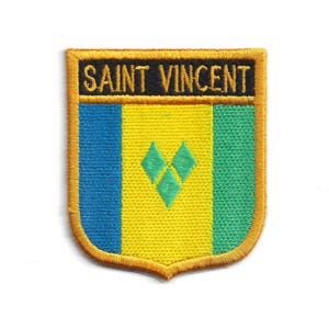 May include: Embroidered patch featuring the flag of Saint Vincent and the Grenadines. The patch has a shield shape with a gold border. The flag design includes blue, yellow, and green vertical stripes, with three green diamonds in the yellow section. The text "SAINT VINCENT" is at the top.