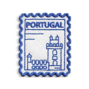 May include: A rectangular embroidered patch shaped like a postage stamp with a white background and blue thread detailing. The design features the word PORTUGAL at the top and a line drawing of a tower and building structure in blue thread.