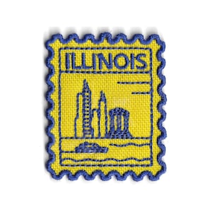May include: A yellow patch with a blue scalloped border and the word "ILLINOIS" in blue. The patch features a blue illustration of buildings and a body of water.