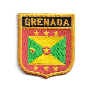 May include: Embroidered patch featuring the flag of Grenada. The patch has a shield shape with a gold border. The top of the shield reads "GRENADA" in black letters. The flag design includes a yellow and green center with a red border and stars.